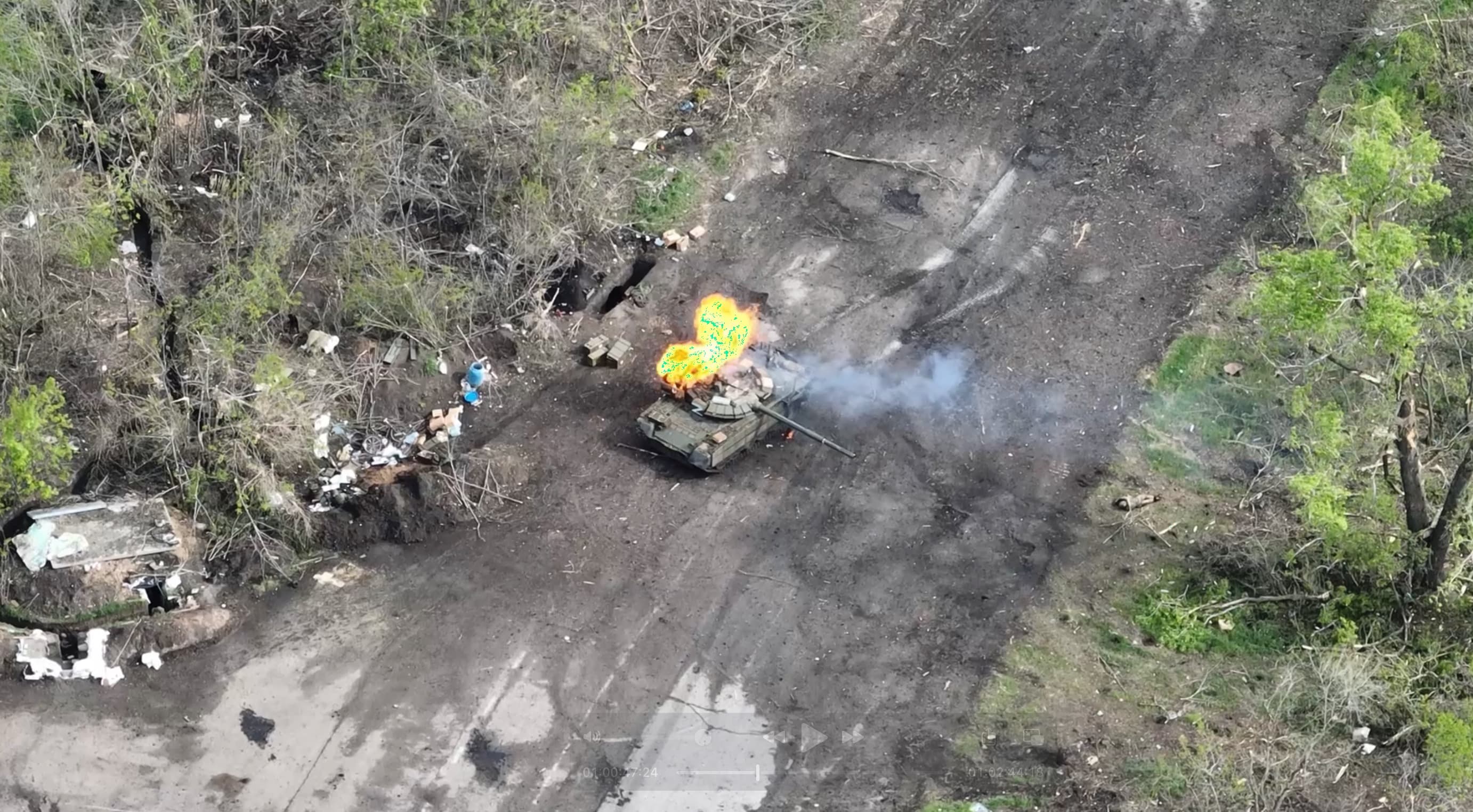 Blurred preview: Our unit has provided view for destroying russian tank. It was a hard battle. The tank was damaged, but continued the fight. For infantry, a tank is the most terrible weapon.
